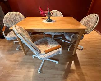 Kitchen table and four chairs on wheels