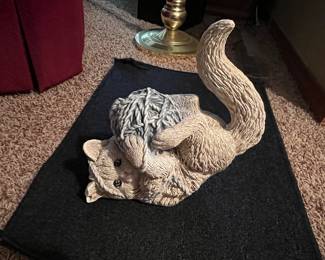 Kitty playing with yard ball