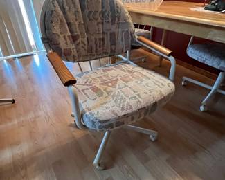 Kitchen table and four chairs on wheels