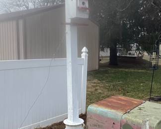 Two outdoor Birdhouses mounted in a old Milk Can - approximately 10-12' tall