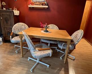 Kitchen table and four chairs on wheels