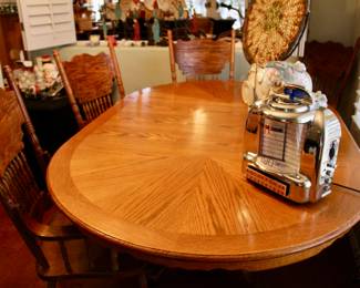 Large oval wood dining table in perfect condition with leaf and dining chairs