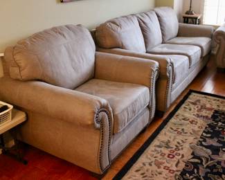 Light gray studded sofa and loveseat set in perfect condition