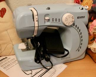 Adorable blue sewing machine