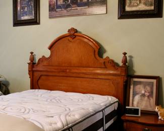 Queen sized mattress and wood bed frame