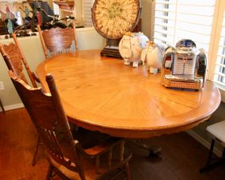 Large wood dining table with four chairs