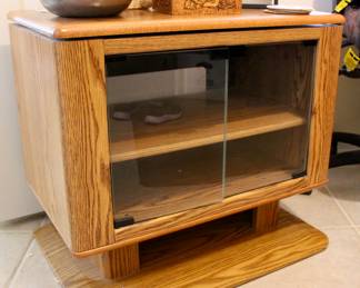 Wood storage case with swiveling top