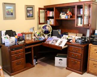 Large corner-oriented office desk and cabinet