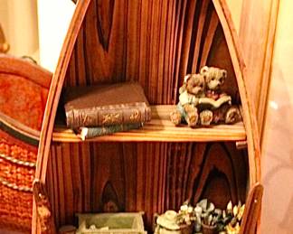 Boat-shaped wooden display shelf