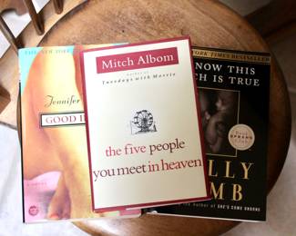 Various books and “The Five People You Meet in Heaven” by Mitch Albom