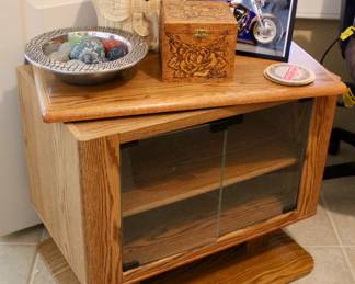 Small wooden storage case with swiveling top