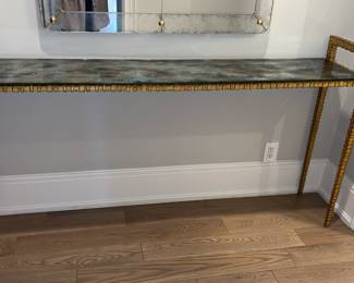 John Richard Luna narrow console table with glass top. Hard to find item. 35 x 66.5 x 13  
