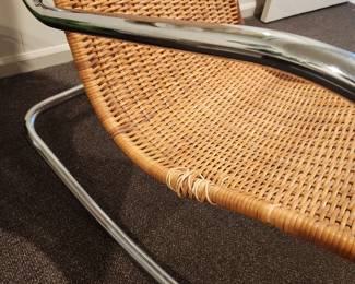 Available for Presale: C4 Mid Century Italian Rattan Rocking Chair with Chrome Handles. Minimal Damage of Sides. H (back of chair): 43" x D 22" x W 21" x H (seat) 19" 