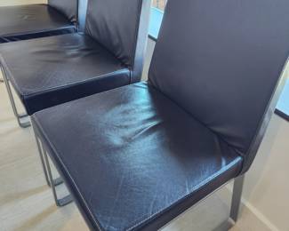 Available for Presale: C3- 6 Armless side chairs by Blueprint Furniture, Los Angeles, CA . Coffee leather, satin finish steel base. There are some very minor scratches on the chairs that could be. Leather could eliminate many of the minor scratches. Please inspect each photo carefully.  Back 34"H, Seat 19" H, W19" x D 17" 