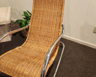 Available for Presale: C4 Rattan Rocking Chair with Chrome Handles. Minimal Damage of Sides. H (back of chair): 43" x D 22" x W 21" x H (seat) 19" 