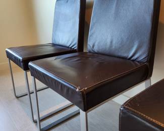 Available for Presale: C3- 6 Armless side chairs by Blueprint Furniture, Los Angeles, CA . Coffee leather, satin finish steel base. There are some very minor scratches on the chairs that could be. Leather could eliminate many of the minor scratches. Please inspect each photo carefully.  Back 34"H, Seat 19" H, W19" x D 17" 