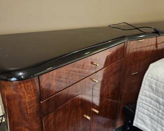 Available for Presale: B1 Brown & Black Drexel Heritage Furnishings Bedframe. Double platform bed, storage headboard with built in electrical power strip, side night stands with storage cabinet, draw, and pullout shelf. 9.6' W x 29" H x 6-12" D at various areas. Mattress is not included. Black lacquered top has chips on it. 