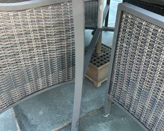 Available for Presale. O1- 4 Wicker Chairs & Metal Table with Umbrella. Tops of Chair backs have wear & tear. Slight hole on top of table where umbrella is. 42"D x 41"W x H 29". Chair Back 34"Hx W9" x D19". Seat 20"