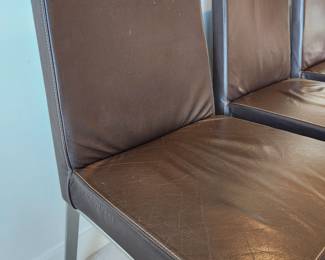 Available for Presale: C3- 6 Armless side chairs by Blueprint Furniture, Los Angeles, CA . Coffee leather, satin finish steel base. There are some very minor scratches on the chairs that could be. Leather could eliminate many of the minor scratches. Please inspect each photo carefully.  Back 34"H, Seat 19" H, W19" x D 17" 