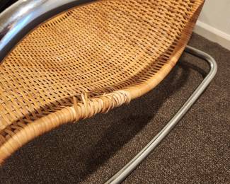 Available for Presale: C4 Mid Century Italian Rattan Rocking Chair with Chrome Handles. Minimal Damage of Sides. H (back of chair): 43" x D 22" x W 21" x H (seat) 19" 