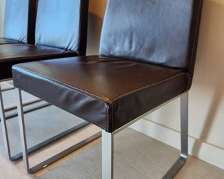 Available for Presale: C3- 6 Armless side chairs by Blueprint Furniture, Los Angeles, CA . Coffee leather, satin finish steel base. There are some very minor scratches on the chairs that could be. Leather could eliminate many of the minor scratches. Please inspect each photo carefully.  Back 34"H, Seat 19" H, W19" x D 17" 