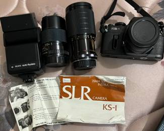 camera with flash and several lenses