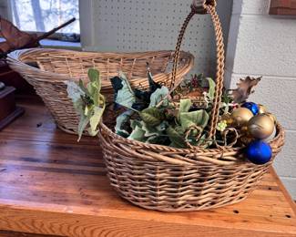 Two large baskets with gold finish, ornament and leafy decorations, largest basket is 24"L