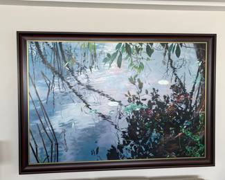 OBJECT: Painting
ARTIST: David Kessler (USA b. 1950- )
TITLE: Evening Sillouettes DATE: 1997
MEDIUM: stencil, airbrush, acrylic on canvas
SIGNATURE: at verso; dated, titled, stamped
DIMENSIONS: 47.5 X 72 inches FRAME DIMENSIONS: 55 X 79 inches
DESCRIPTION: This piece is a photo-realist depiction by Mr. Kessler who uses acrylic and airbrush to create realistic depictions of water and reflections. He is inspired by the natural beauty of ponds, lakes, and rivers, and the way light interacts with water and plants. He has been creating his artworks for over thirty years, and has exhibited in various venues across the United States and France. CONDITION: overall in very good condition.   Price $4000