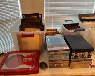 Frames, frames, frames! Most are unused and come in a variety of sizes.   Unopened and unused photo storage boxes.