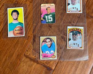 Lew Alcindor (aka Kareem), 2 Willie Mays, OJ Simpson, Bart Starr.  Many more basketball, baseball and Football trading cards.
