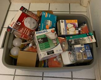Bin full of lightbulbs, timer control for a lamp, one smoke detector.