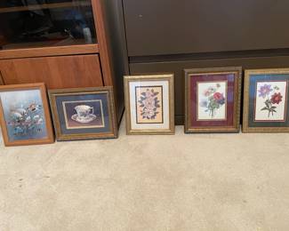 Three floral themed prints, tea cup, and fish scene wall art