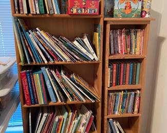 Childrens books, on bookcases that are also for sale.