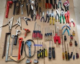 Adjustable wrenches, screw drivers, strap wrenches, pipe wrench, pliers, vise grip wrenches, pipe cutter, electrical crimping tools, tin snips