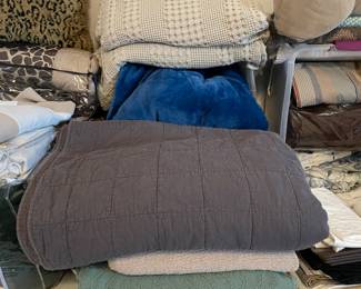 Several cozy throw blankets and bed sized blankets, queen gray bedspread,