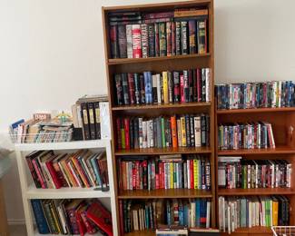 Steven King collection, large selection of novels, humor and satire, dictionaries, gardening, trivia, many books on woodworking, carpentry, home repair, maps.  Many DVD movies in many genres.  Bookshelves also for sale