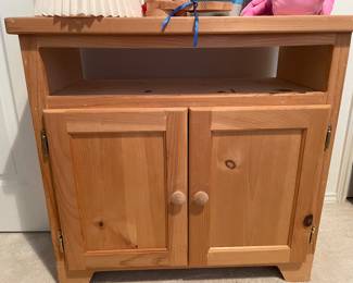 Unfinished cabinet with open shelf and roomy cupboard beneath.