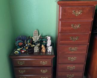 Night table, tall chest. Zoom in to see some home decor on top