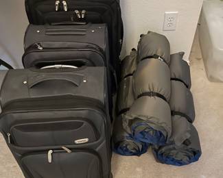 3 suitcases of various sizes, 3 camping bed rolls (air cushioned)