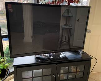 flat screen TV and stand