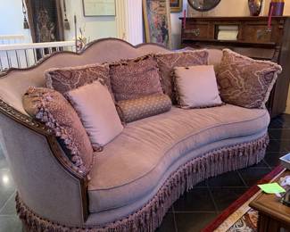 lovely couch, wood trim, fringe