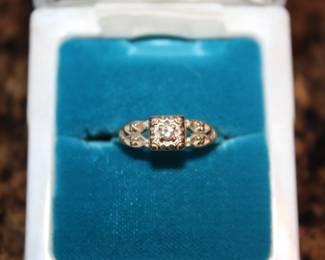 14K Gold with diamond center stone
