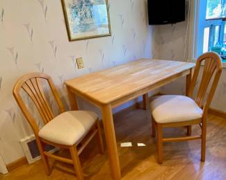 Sweet and simple kitchen table made from solid wood.