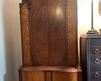 This is a truly unique period chiffarobe (wardrobe) with dynamic veneers and gorgeous carved details. Next image is a detail.