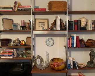 This is a house full of treasures gathered in travels around the world: hand carved wooden bowls, statuary, gilded frames, and ceramic and glass vessels.