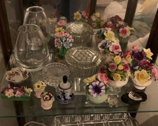 Quite an array of cut glass, crystal, and ceramic statuary and sculpture.