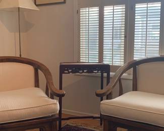 Handsome oak chairs with off-white cushions in pristine condition. This small side table is one of a couple in a chinoiserie style, handsomely carved.