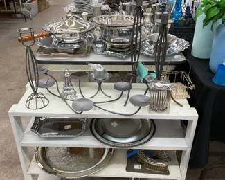 Silver serving trays and small wooden bookshelves 