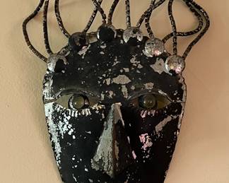 Metal folk art masks