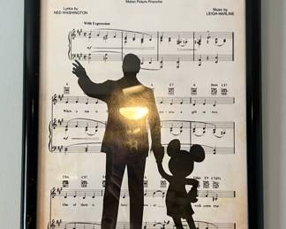 Framed sheet music with Walt Disney and Mickey Mouse silhouette